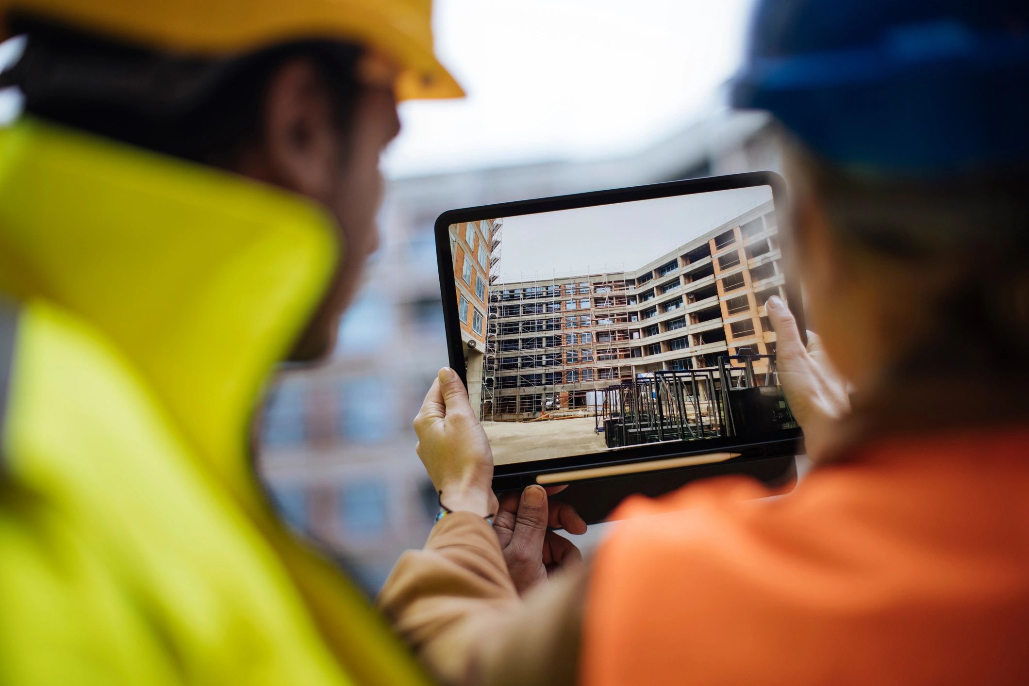 builders watching video on tablet